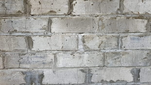 Gray stone wall background. The texture of the stone. Old castle wall background. Stone wall as a background or texture. Part of the wall, for background or texture