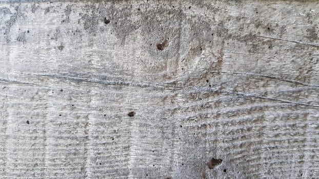 Beautiful concrete background with wood texture. Concrete wall flooring casing wood flooring texture. Mold traces for cement formwork