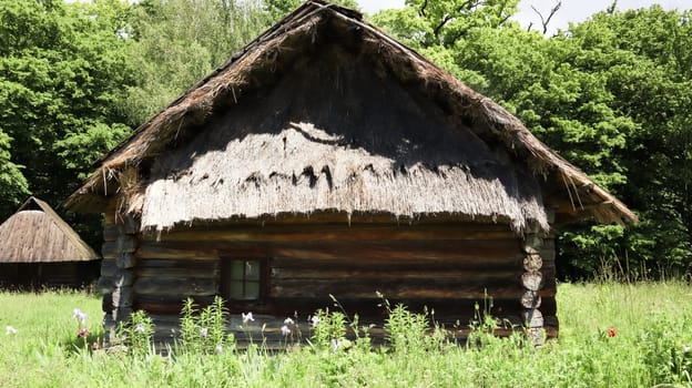 Ukraine, Kiev - June 11, 2020. The old house of peasants in the museum Pirogovo. National Museum of Folk Architecture and Everyday Life of Traditional Folklore Houses of Different Regions of Ukraine.