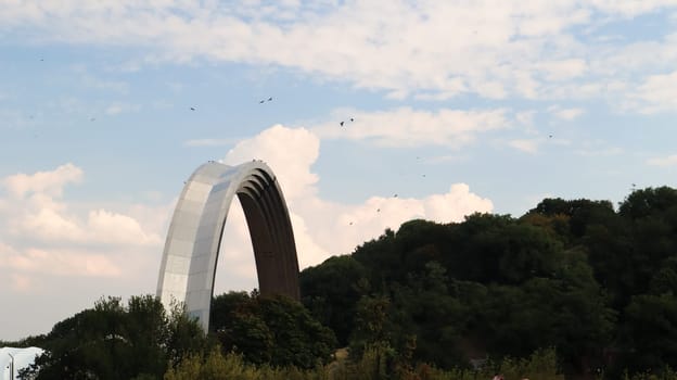 View of the memorial Arch of Friendship of Peoples. Sight of Kiev, located on the right bank of the Dnieper. Ukraine, Kiev - September 6, 2020
