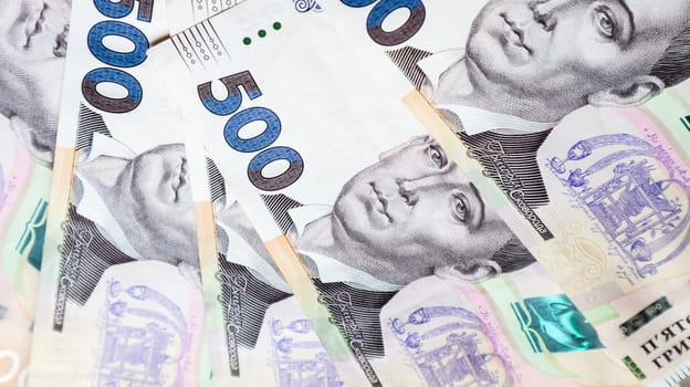 Ukrainian hryvnia, a lot of new banknotes in denominations of 500 hryvnias beautifully laid out on the table. Financial background, money