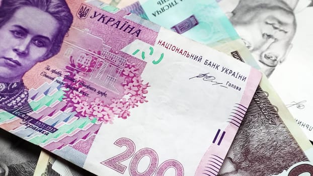 Banknotes of 200 hryvnia. National currency of Ukraine. Cash paper money close up background