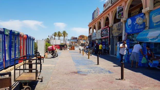 Egypt, Sharm El Sheikh - June 13, 2019: Unidentified people visit shopping centers on the city streets. Typical shopping street with arabic souvenir shops