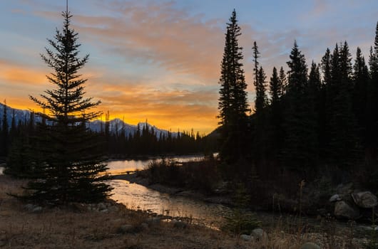 Stunning sunrise scenery of Bow River and Castle Mountains at Banff National Park in Alberta, Canada. View from Castle Junction.