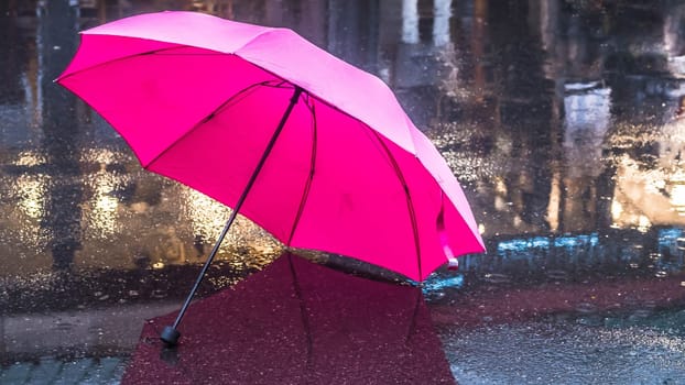 Pink Umbrella after the rain. Pink umbrella on the wet