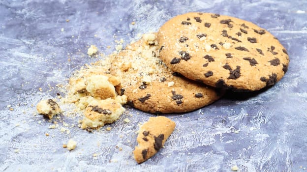 Soft, freshly baked chocolate chip cookies on a gray marble kitchen countertop. American traditional sweet pastry pastry, delicious homemade dessert. Culinary background
