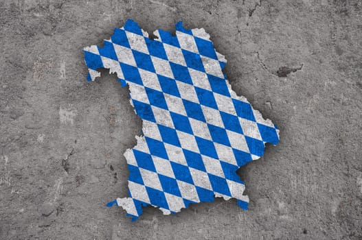 Map and flag of Bavaria on weathered concrete
