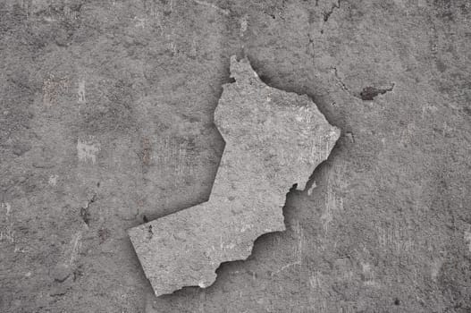 Map of Oman on weathered concrete