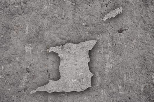 Map of Trinidad and Tobago on weathered concrete