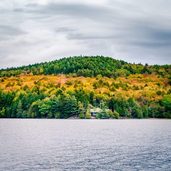 Fall colors on the shores of Long Pond in Acadia National Park in Maine