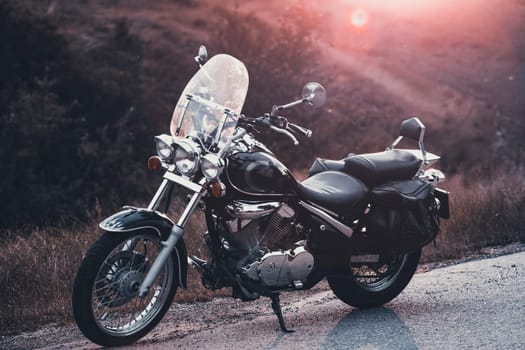Vintage motorcycle on country road.