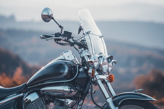 Motorcycle detail closeup front fork and headlight. Travel and sport, speed and freedom concept