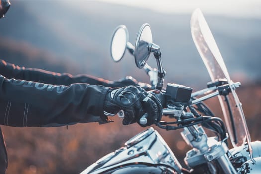 Motorcycle driver riding on countryside. Travel and sport, speed and freedom concept