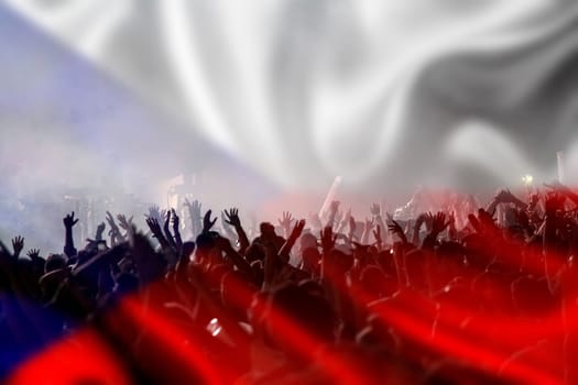 Soccer fans supporting Czech Republic- crowd celebrating in stadium with raised hands against Czech Republic flag