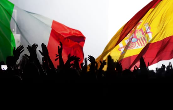 Football match Spain vs Italy. Cheering football fans, supporters.