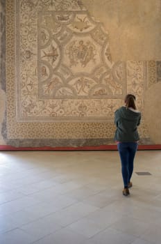 Ecija, Spain - April 21th, 2019: Visitor young woman at Ecija Municipal Museum of History, Seville, Spain