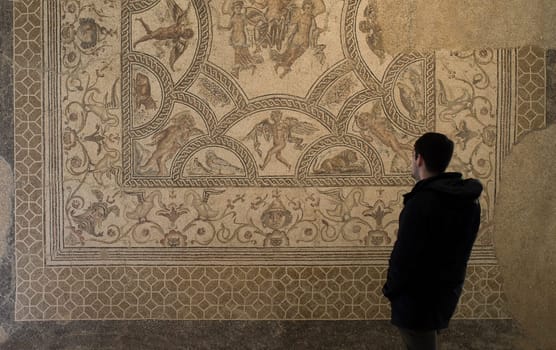 Ecija, Spain - April 21th, 2019: Visitor young man at Ecija Municipal Museum of History, Seville, Spain