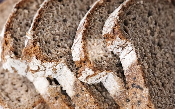 Close-up view of some slices of fresh rye bread. Healthy food and source of fiber. Bakery product