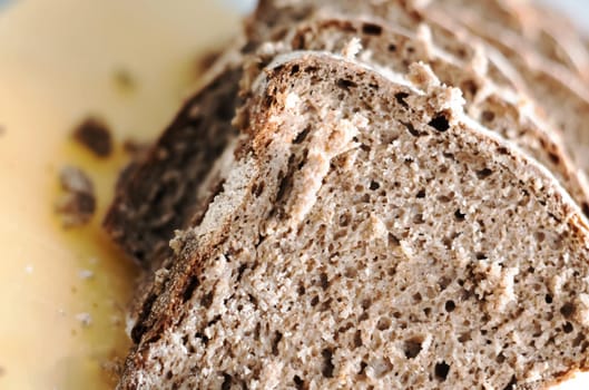 Close-up view of some slices of fresh rye bread. Healthy food and source of fiber. Bakery product