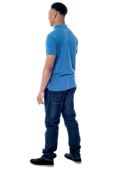 Full length of young man walking ahead