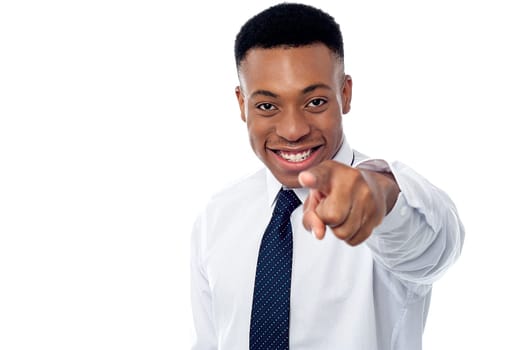 Business executive pointing towards to camera