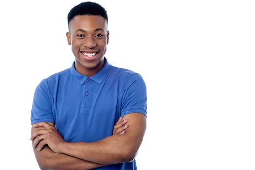 Happy young man posing to camera over white