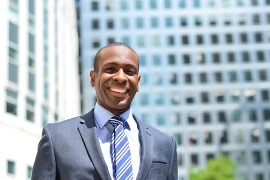 Successful businessman in front of office building