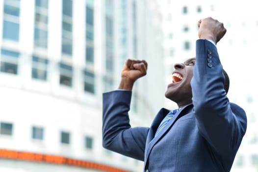 Excited businessman celebrating his success