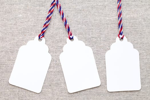 blank tag or label on burlap background