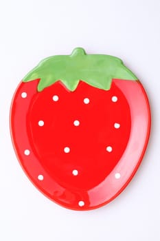 strawberry-shape plate on white background