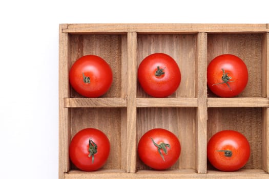 cherry tomatoes in wooden box