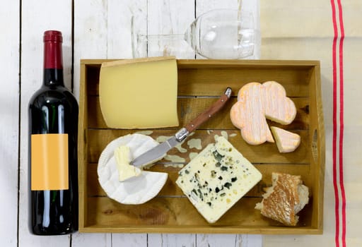 tray different french cheeses with red wine