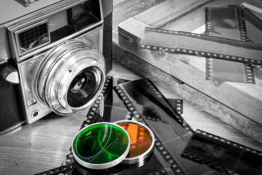 old camera with some accessories and films