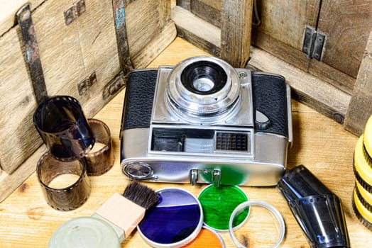 old camera with some accessories and films