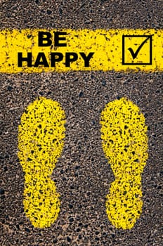 Conceptual image with yellow paint footsteps on the road in front of horizontal line over asphalt stone background. Word XXXXXXXX