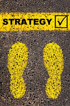 Conceptual image with yellow paint footsteps on the road in front of horizontal line over asphalt stone background. Word XXXXXXXX