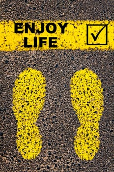 Conceptual image with yellow paint footsteps on the road in front of horizontal line over asphalt stone background. Word XXXXXXXX
