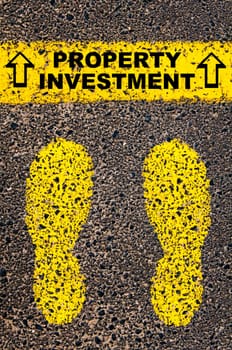 Conceptual image with yellow paint footsteps on the road in front of horizontal line over asphalt stone background. Word XXXXXXXX