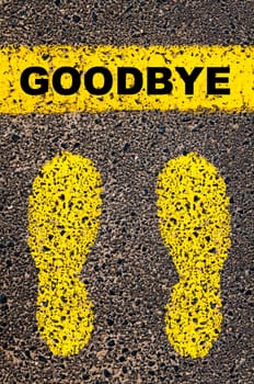 Conceptual image with yellow paint footsteps on the road in front of horizontal line over asphalt stone background. Word XXXXXXXX