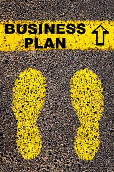 Conceptual image with yellow paint footsteps on the road in front of horizontal line over asphalt stone background. Word XXXXXXXX