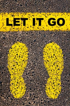 Conceptual image with yellow paint footsteps on the road in front of horizontal line over asphalt stone background. Word XXXXXXXX