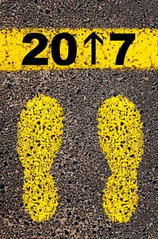 Conceptual image with yellow paint footsteps on the road in front of horizontal line over asphalt stone background. Word XXXXXXXX