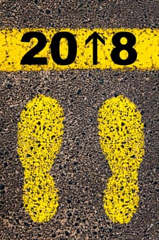 Conceptual image with yellow paint footsteps on the road in front of horizontal line over asphalt stone background. Word XXXXXXXX