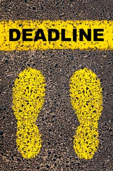 Conceptual image with yellow paint footsteps on the road in front of horizontal line over asphalt stone background. Word XXXXXXXX