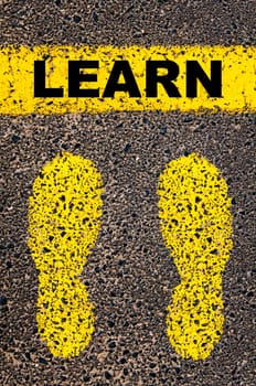 Conceptual image with yellow paint footsteps on the road in front of horizontal line over asphalt stone background. Word XXXXXXXX