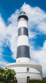 The Chassiron lighthouse with black and white stripes on blue sky, on the island of Oléron in France