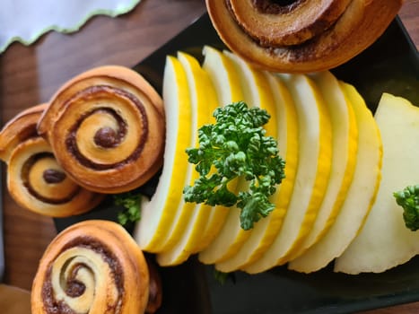Pastries, sweet dessert and decorated fruit in the dining room