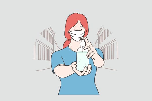 Healthcare, quarantine, infection, coronavirus protection concept. Young woman with medical face mask shows antiseptic lokin at camera. Preventive measures from Covid19 desease and 2019ncov biohazard.