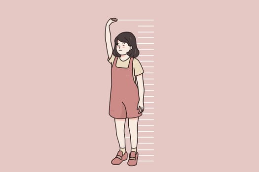 Children growing, height of body concept. Smiling little girl child cartoon character standing near wall measuring height with hands and stripes in pink wall vector illustration