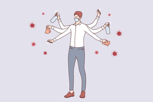 Protection from Coronavirus COVID-19 infection concept. Young businessman in medical face mask with multiple hands washing, sanitising hands and cleaning surfaces to protect from coronavirus
